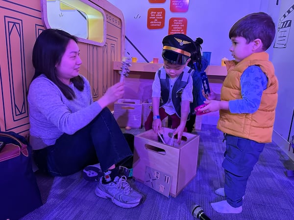 Hyun Seol of Atlanta (left) with her 3-year-old son Minho and Shivaay Mattey, 2, at the Goizueta Children's Experience at the Atlanta History Center on opening day. RODNEY HO/rho@ajc.com