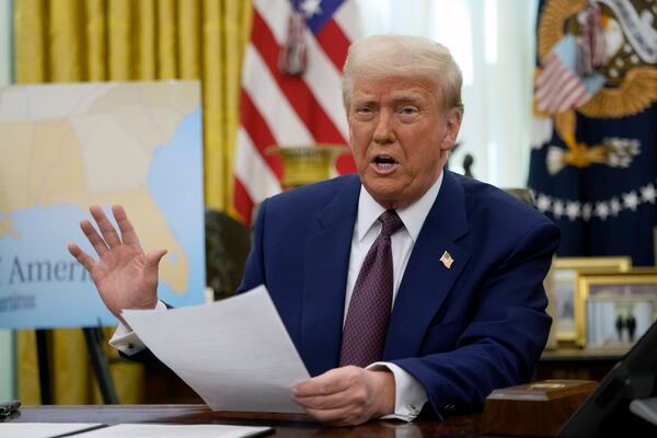 FILE - President Donald Trump speaks to reporters in the Oval Office of the White House, Feb. 13, 2025, in Washington. (AP Photo/Ben Curtis)