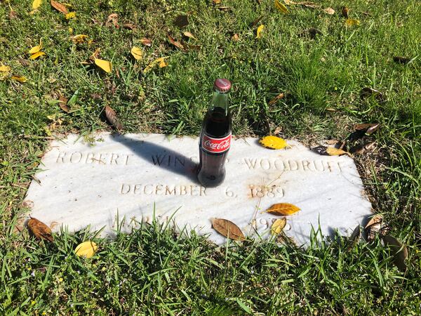 Susan Wietsma took her kids to Westview Cemetery to show them where their great and great great grandparents are buried. She said she liked this image of a Coke bottle on Robert Woodruff’s grave.