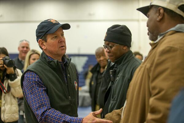 03/04/2019 -- Talbotton, Georgia -- Georgia Governor Brian Kemp speaks with individuals following a press conference at Central High school after surveying storm damage in Talbotton, Monday, March  4, 2019. Keith Stellman, head forecaster for the National Weather Service, said during the presser that the path of destruction in the town looked to be caused by an EF2 tornado, although that wasn't confirmed during the governor's tour.  (ALYSSA POINTER/ALYSSA.POINTER@AJC.COM)