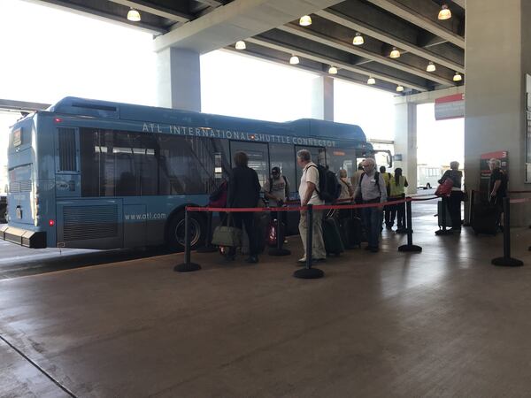 Terminal connector shuttle at Hartsfield-Jackson. The shuttles' livery has changed over the years.