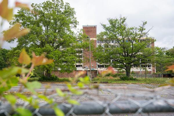 An abandoned hotel deteriorates on land that was recently purchased by the county for redevelopment along Fulton Industrial Blvd in Atlanta, Georgia on Thursday, April 11, 2024. (Olivia Bowdoin for the AJC).