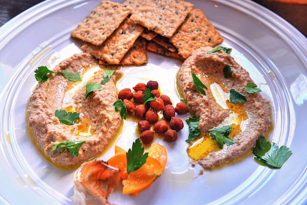 Black Chickpea Hummus with Black Garlic and Preserved Lemon offers exciting pops of unexpected flavor with items well worth adding to your pantry. The recipe is from “Cool Beans” by Joe Yonan (Ten Speed, $30). STYLING BY SUSAN PUCKETT / CONTRIBUTED BY CHRIS HUNT PHOTOGRAPHY