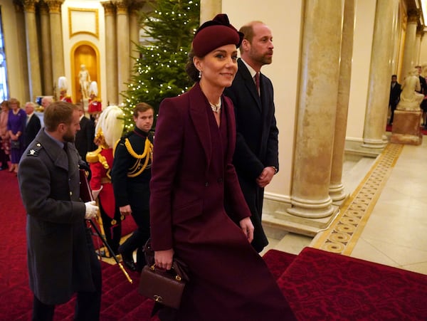 Britain's Prince William and Kate, Princess of Wales arrive at Buckingham Palace, London during the state visit to the UK of the Emir of Qatar Tuesday Dec. 3, 2024. (Jonathan Brady, Pool via AP)