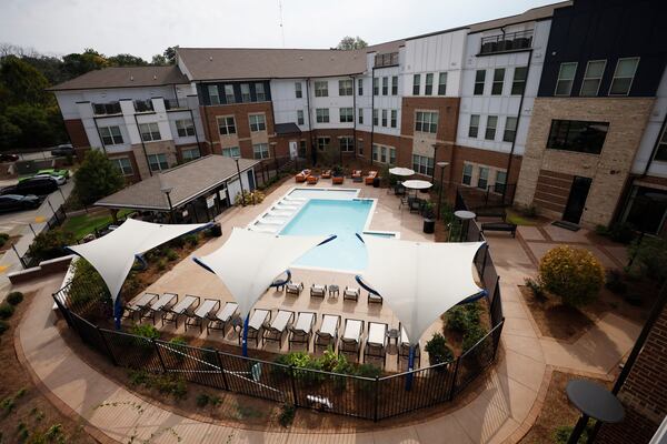 The pool view from the rooftop is seen during the tour of the mix-housing building at Ashley Scholar Landing on Tuesday, Sept. 26, 2023.  The beginning of the second phase of multi-family housing was announced at a press conference in Atlanta. 
Miguel Martinez /miguel.martinezjimenez@ajc.com