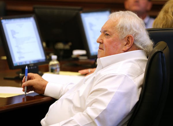 School board chairman Phillip Beard listens while residents speak out during the Buford Board of Education meeting on Monday, Aug. 27, 2018, in Buford. It was the first meeting since Superintendent Geye Hamby resigned amid allegations he used racial slurs to refer to black temporary construction workers and threatened violence against them. CURTIS COMPTON/ccompton@ajc.com