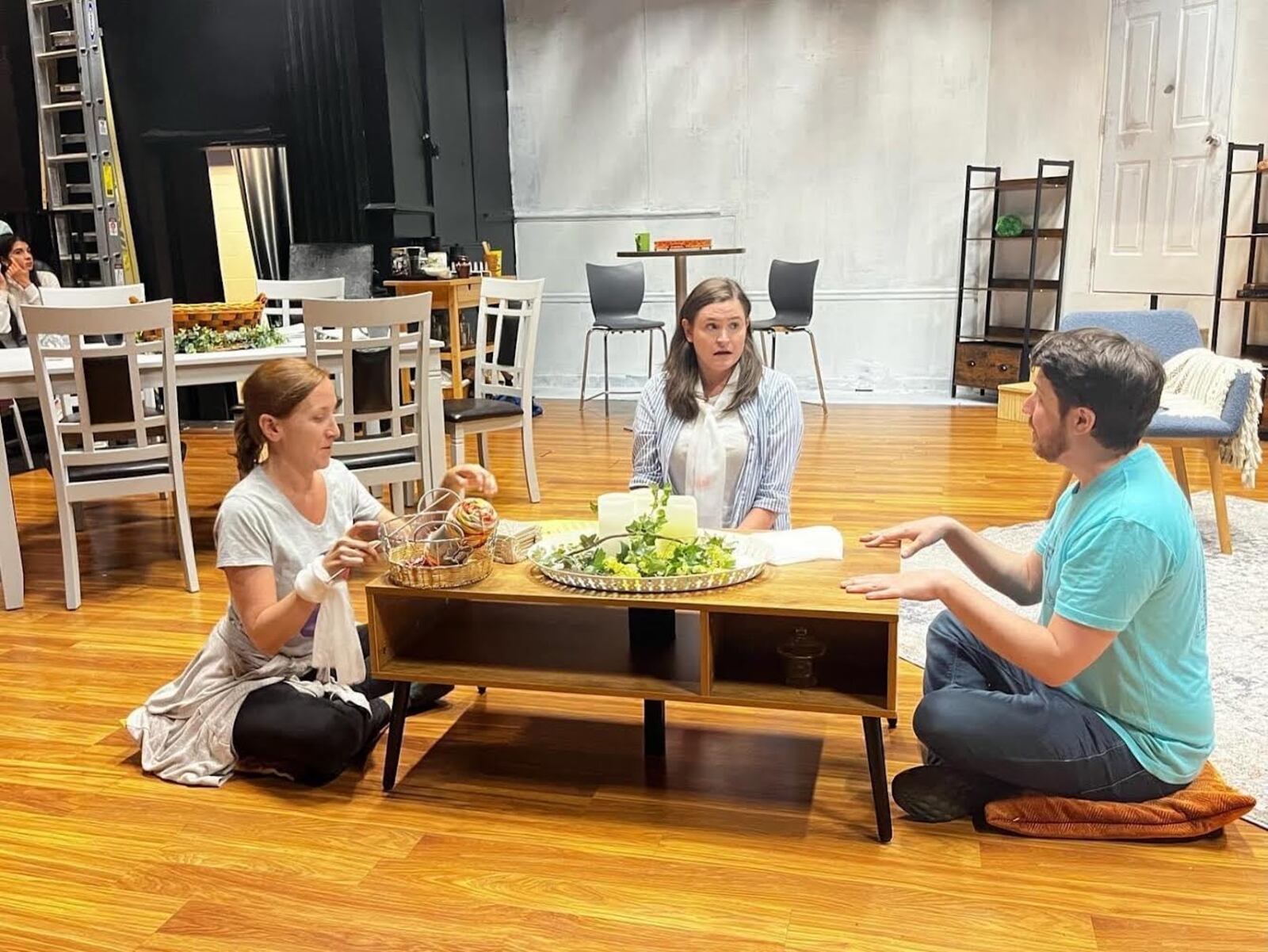 From left, two congregants (Jaclyn Faircloth and Kate Lightburn) meet with their minister (Adam King) in “The Pros and Cons of Killing Your Cult Leader.” Photo: EmJ Fulford