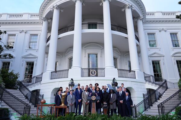 President Joe Biden, center, speaks during an event to welcome the Boston Celtics and celebrate their victory in the 2024 National Basketball Association Championship, on the South Lawn of the White House in Washington, Thursday, Nov. 21, 2024. (AP Photo/Susan Walsh)