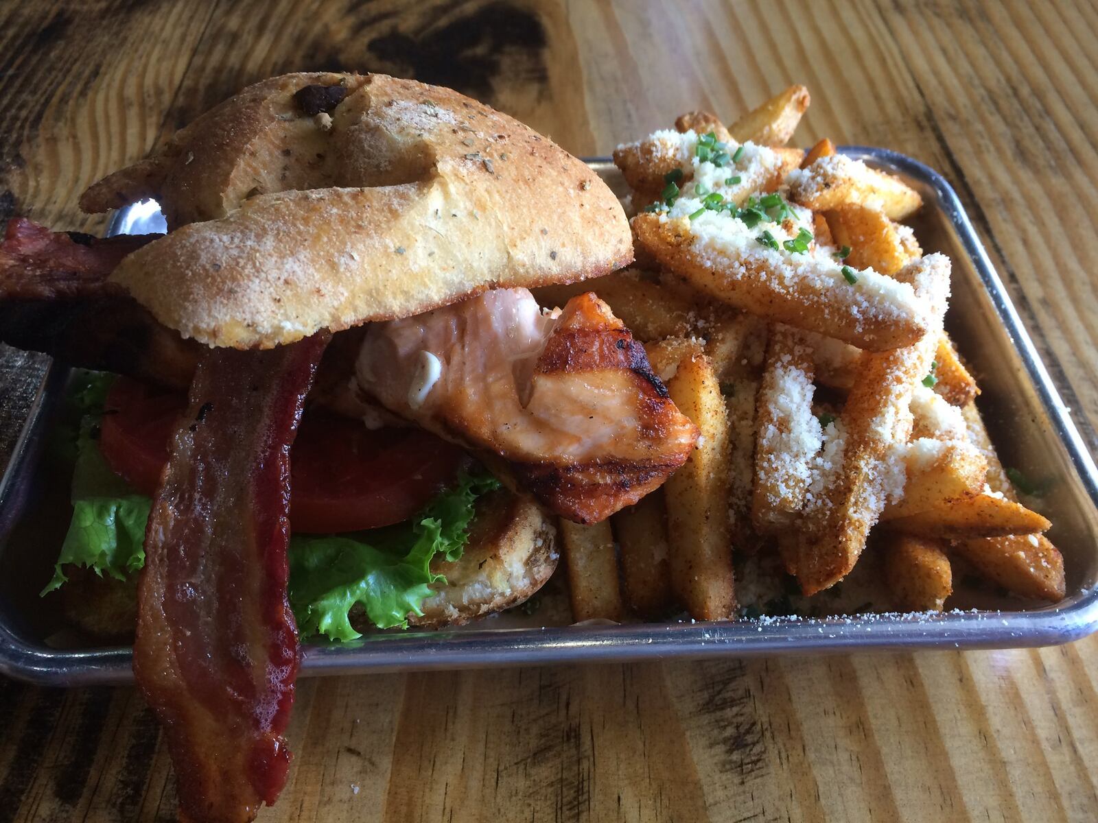 The Little Farmhouse Cafe’s grilled salmon BLT and Parmesan fries. CONTRIBUTED BY WENDELL BROCK