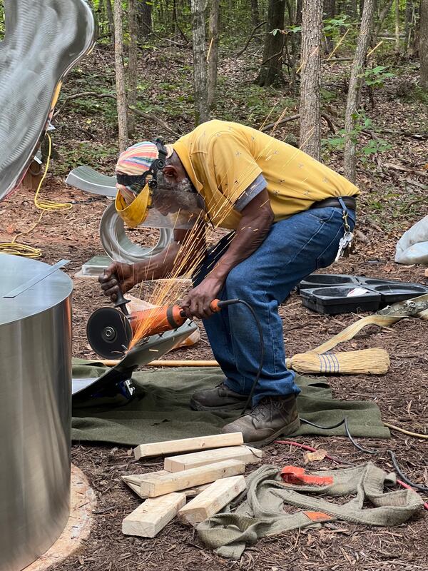 Sculptor Curtis Patterson appreciates the physicality of sculpture and how it displaces space -- he describes the creation as drawing in space versus drawing on space. (Photo by Wanda Hughes)