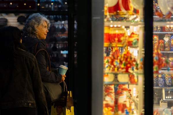 People window shop in Bryant Park's Winter Village, Tuesday, Nov. 26, 2024, New York. (AP Photo/Julia Demaree Nikhinson)