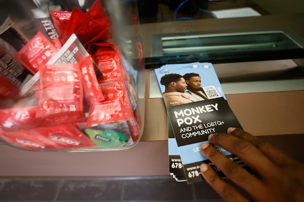 At the office entrance, clients can find vital information and prevention material for the community, like monkeypox pamphlets and condoms.  Miguel Martinez / miguel.martinezjimenez@ajc.com