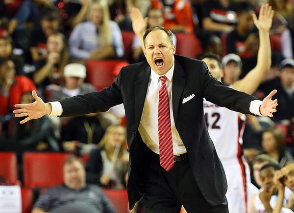 111513 ATHENS: Georgia head coach Mark Fox encourages his team against Georgia Tech during the second half of a 80-71 loss on Friday, Nov. 15, 2013, in Athens. CURTIS COMPTON /staff CCOMPTON@AJC.COM We can assume this was not Mark Fox's reaction to his new deal. (Curtis Compton/AJC)