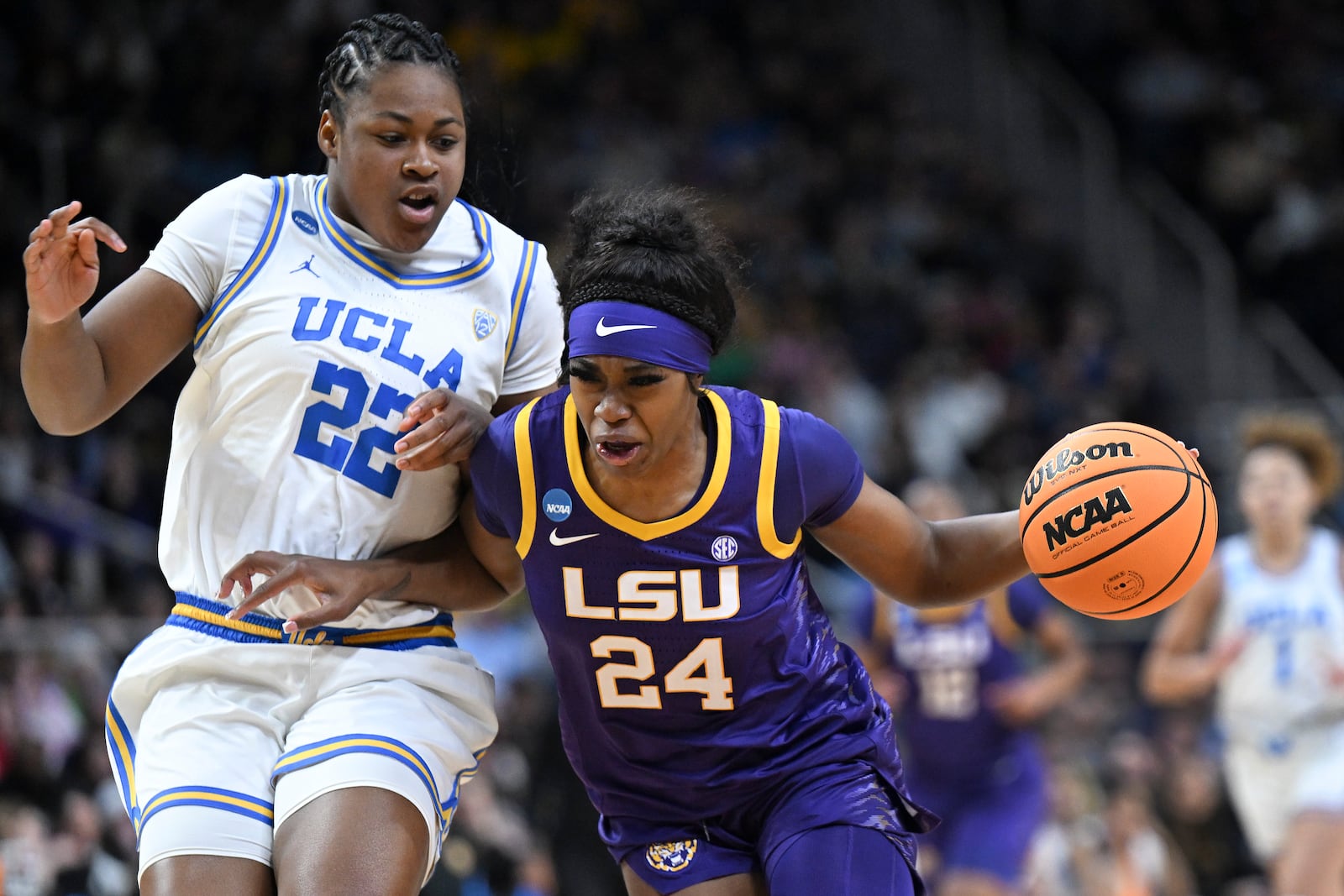 FILE - LSU guard Aneesah Morrow (24) drives against UCLA forward Christeen Iwuala (22) during the fourth quarter of a Sweet Sixteen round college basketball game during the NCAA Tournament, Saturday, March 30, 2024, in Albany, N.Y. (AP Photo/Hans Pennink, File)