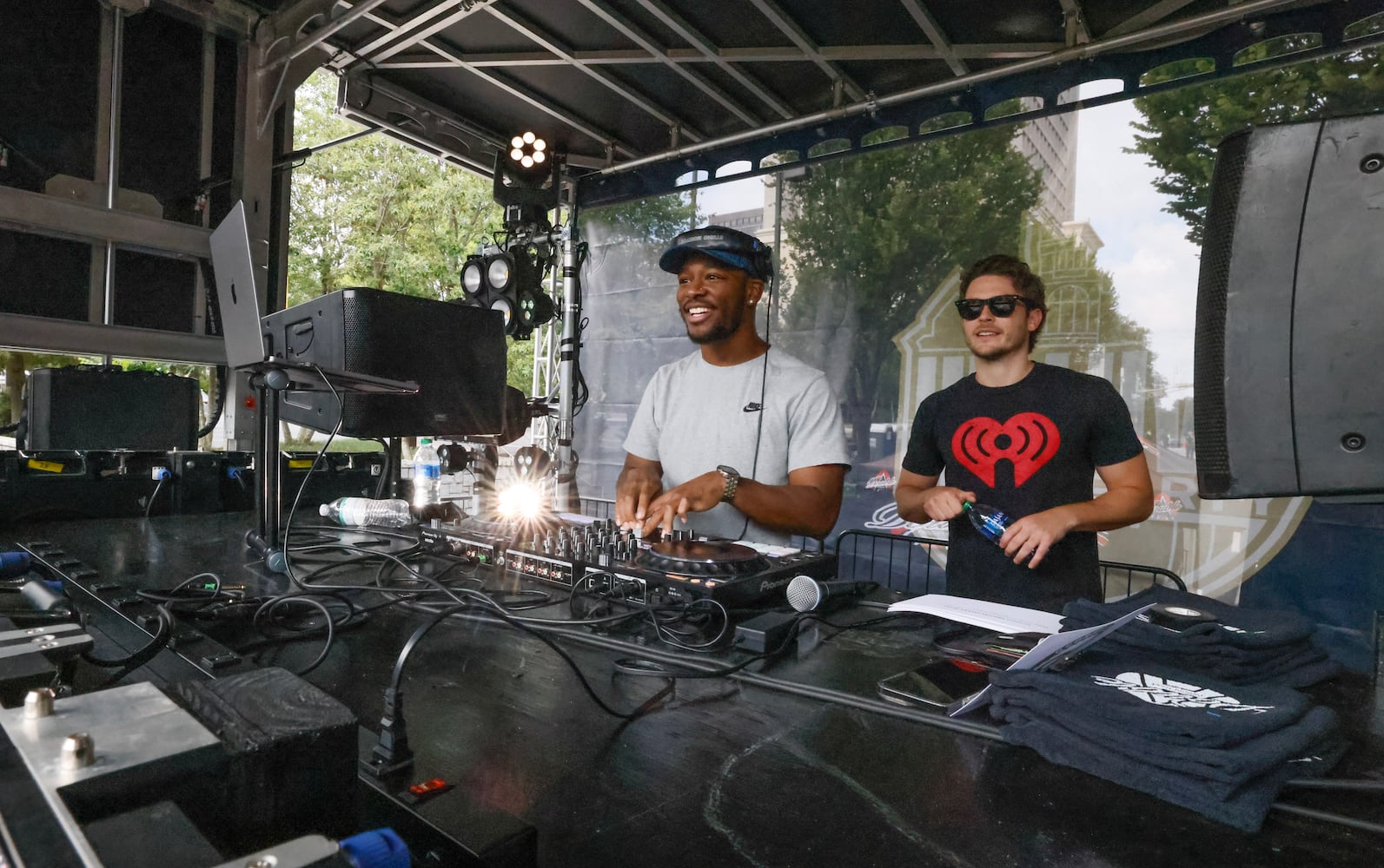 DJ MiKeith (left) and Ethan Cole from Power 961 entertain the crowd before DJ Envy took the stage.   (Bob Andres for the Atlanta Journal Constitution)