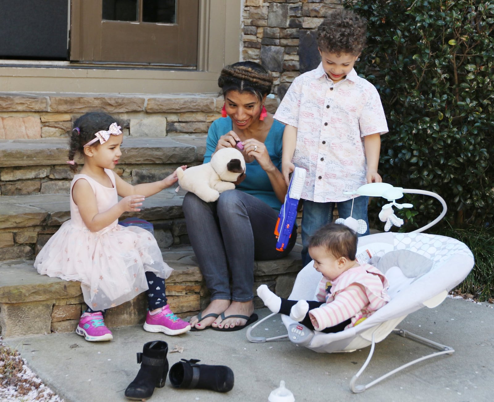 Debra Shigley, who has five children under age 8, plays with her children in their backyard in Atlanta. EMILY HANEY / EMILY.HANEY@AJC.COM