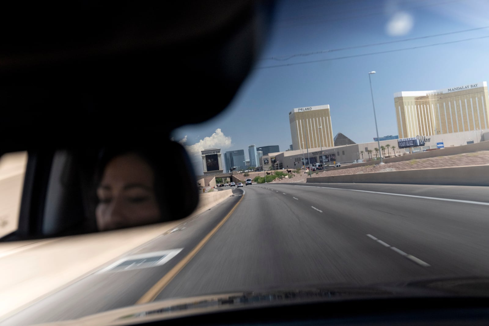 Buttons, an adoptee from Iran who grew up to find out she was never naturalized, drives through Las Vegas, Wednesday, June 26, 2024. She had hope. She's lost that now. For a decade, legislation has been introduced year after year, it dies, and nothing happens. (AP Photo/David Goldman)