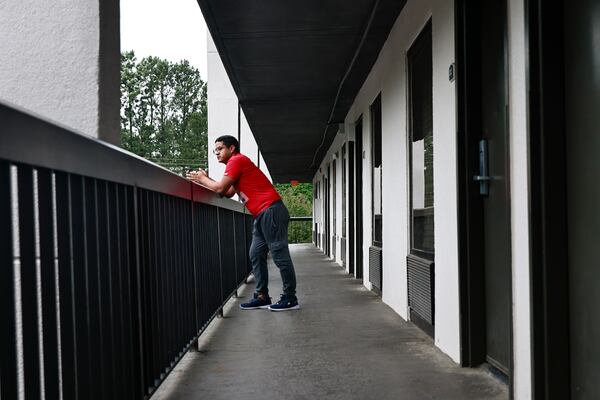 Klinsman Torres, 31, stands outside of the hotel he is temporarily living in while seeking asylum in the U.S. The Venezuelan national is receiving assistance from the Latin American Association in Atlanta. Friday, September 9, 2022. (Natrice Miller/natrice.miller@ajc.com). 