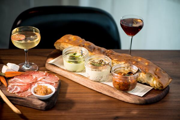 Wood-fired focaccia with seasonal cicchetti, which is served in jars. Photo credit- Mia Yakel.