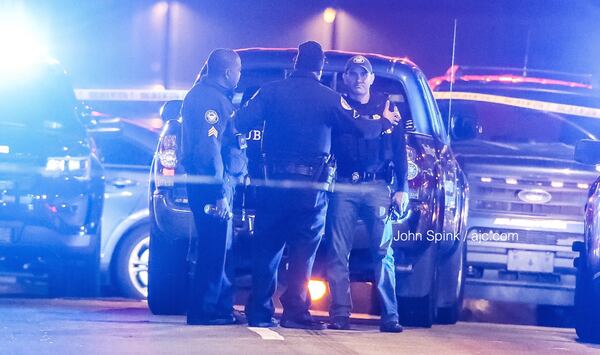 Atlanta police investigate a shooting Tuesday morning outside the Varsity in Midtown. JOHN SPINK / JSPINK@AJC.COM