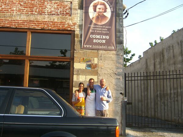 Matt Ruppert (center) in front of Noni's with his parents in 2018. / Courtesy of Noni's