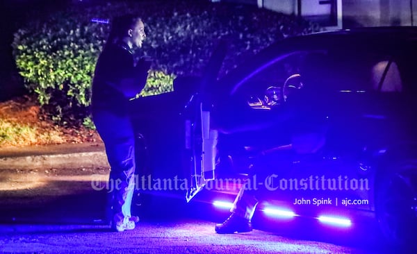 GBI investigators worked through the night at the Chelsea Gardens Apartments on Godby Road after a man was killed by a sheriff's deputy Tuesday.