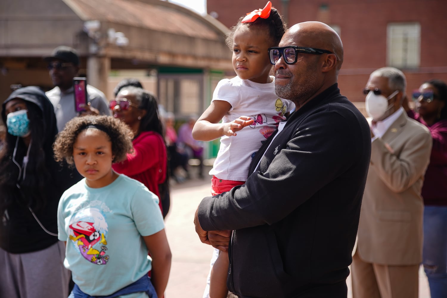 People listen to a speaker at a wreath laying ceremony at The King Center on the 54th anniversary of the assassination of Dr. Martin Luther King Jr., on Monday, April 4, 2022, in Atlanta. (Elijah Nouvelage/Special to the Atlanta Journal-Constitution)