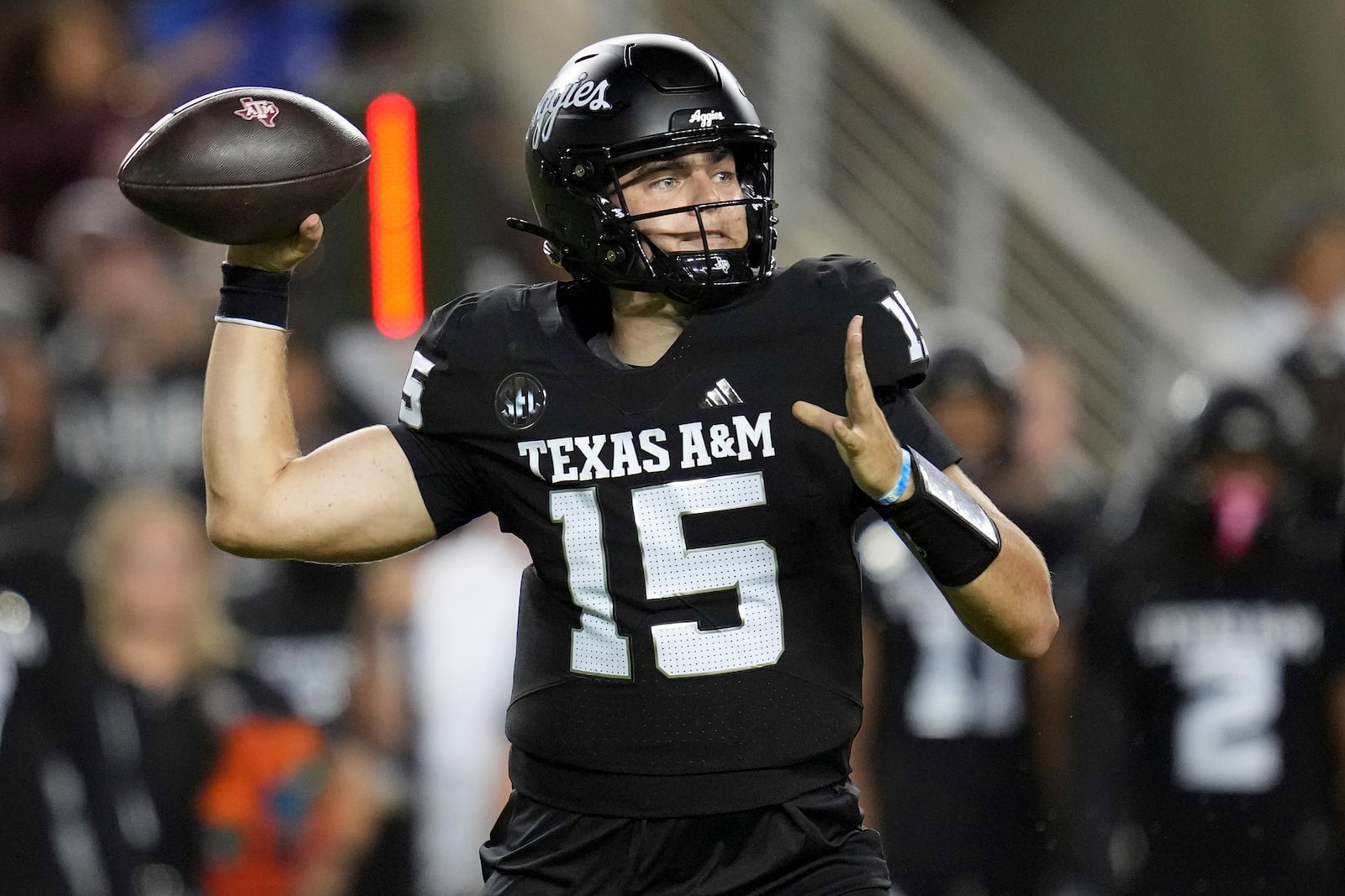 Texas A&M quarterback Conner Weigman (15) passes down field against LSU during the first half of an NCAA college football game Saturday, Oct. 26, 2024, in College Station, Texas. (AP Photo/Sam Craft)