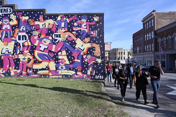 Attendees participate in walking tour of South Downtown lead by Jon Birdsong and April Stammel, Tuesday, Mar. 12, 2024, in Atlanta. (Hyosub Shin / Hyosub.Shin@ajc.com)