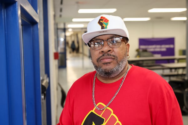 Juan Pullen, parent of two RISE Prep School students, is in the school cafeteria, on Wednesday, Feb. 22, 2023, in East Point, Ga. The RISE Prep and Grammar schools are in jeopardy of being closed by Fulton County Schools. Jason Getz / Jason.Getz@ajc.com)