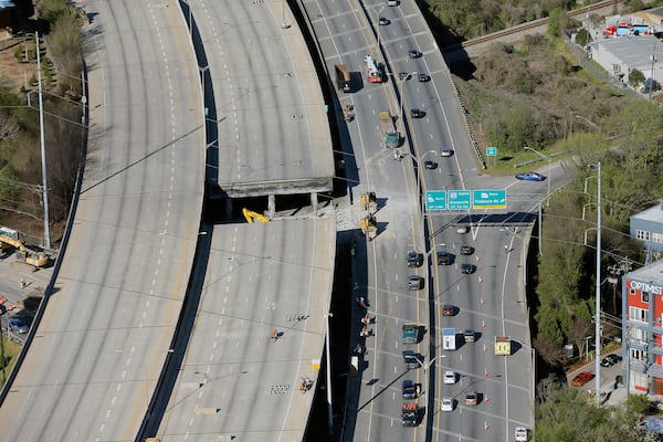 Fire in the hole (March 30, 2017): A section of I-85 north collapsed when materials stored beneath it caught fire. The clean-up and reconstruction lasted until May 15 and closed off the interstate and Piedmont Road. (BOB ANDRES  /BANDRES@AJC.COM)