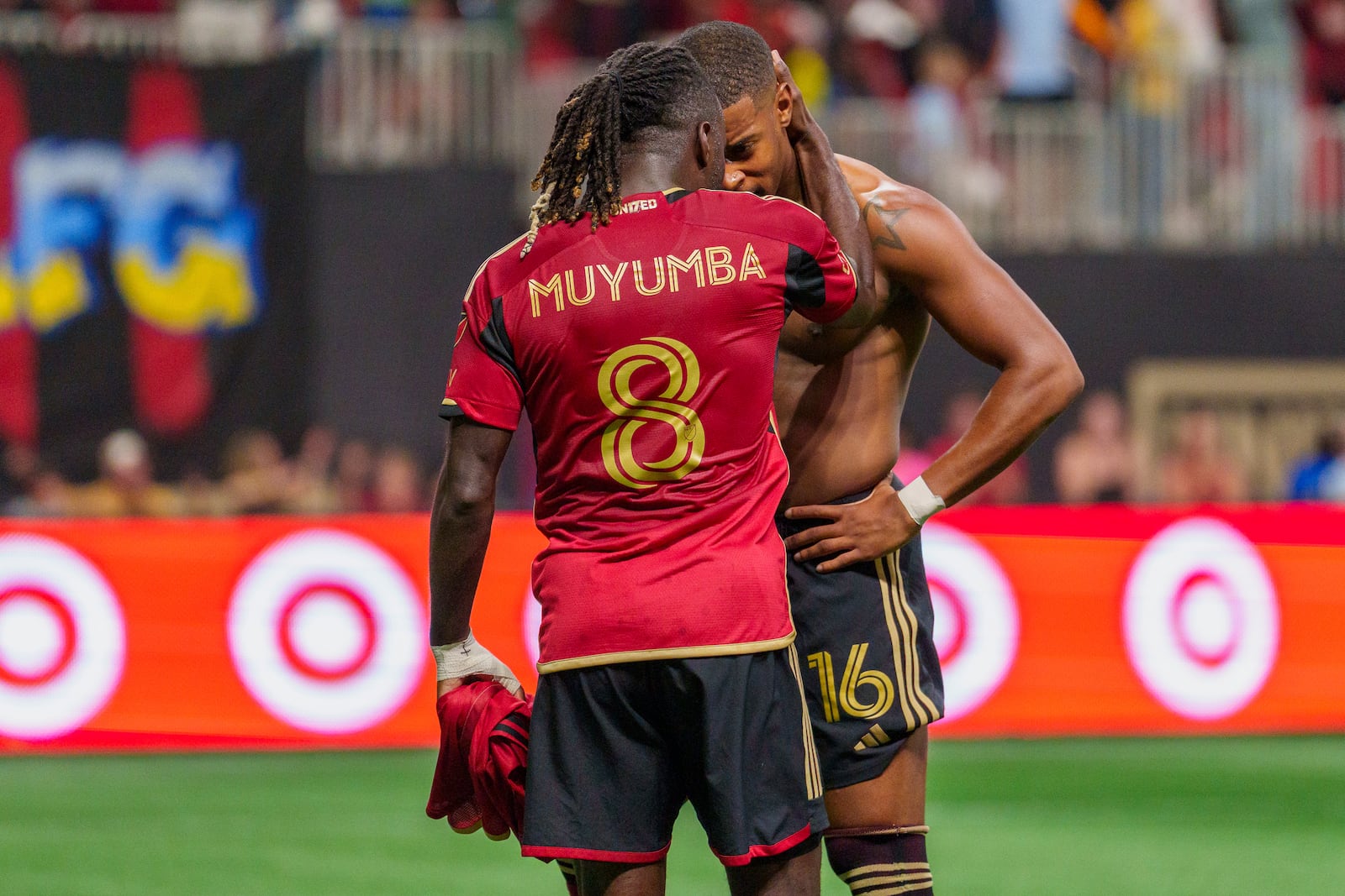 Atlanta United forward Xande Silva (16) and midfielder Tristan Muyumba (8) celebrate Silva's goal during stoppage time in the second half of an MLS soccer match against Inter Miami, Saturday, Nov. 2, 2024, in Atlanta. (AP Photo/Jason Allen)