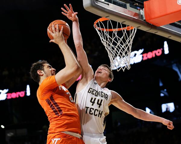 Georgia Tech's Ben Lammers, right, plays against Virginia Tech's Satchel Pierce in the first half of an NCAA college basketball game Saturday, Jan. 16, 2016, in Atlanta. (AP Photo/David Goldman)