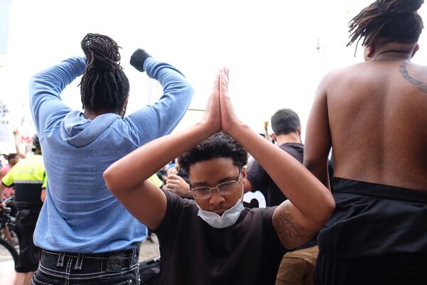 May 29, 2020 -  Atlanta -  After a peaceful march the Georgia State Capitol that swelled into the hundreds,  protestors returned to the area around the Centennial Olympic Park and CNN center where some confronted police, who sprayed some demonstrators with pepper spray.  They carried signs and chanted their messages of outrage over the death of George Floyd in Minneapolis.     Ben Gray for the Atlanta Journal Constitution