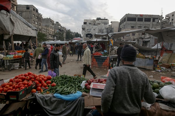 Palestinians shop at Sheikh Radwan Market, west of Gaza City, before the Iftar, the fast-breaking meal, during the holy month of Ramadan on Monday, March 3, 2025. (AP Photo/Jehad Alshrafi)