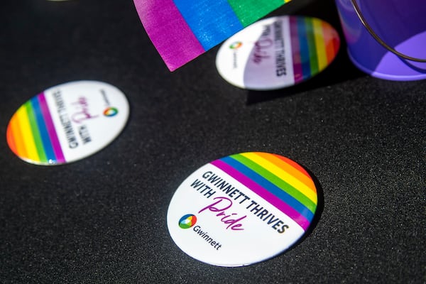 Gwinnett County Pride buttons are displayed during the inaugural Gwinnett County Pride Party in the plaza outside of the Gwinnett County Justice and Administration Center in Lawrenceville, Monday, June 28, 2021. (Alyssa Pointer / Alyssa.Pointer@ajc.com)

