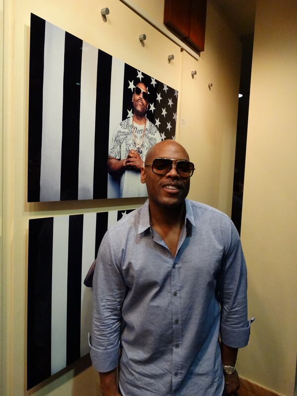 DJ Toomp, a key producer for T.I., is part of the VH1 documentary. The Rialto, where the screening was held August 31, features a photo gallery of many of the participants from the documentary. So DJ Toomp poses with his own photo. CREDIT: Rodney Ho/rho@ajc.com