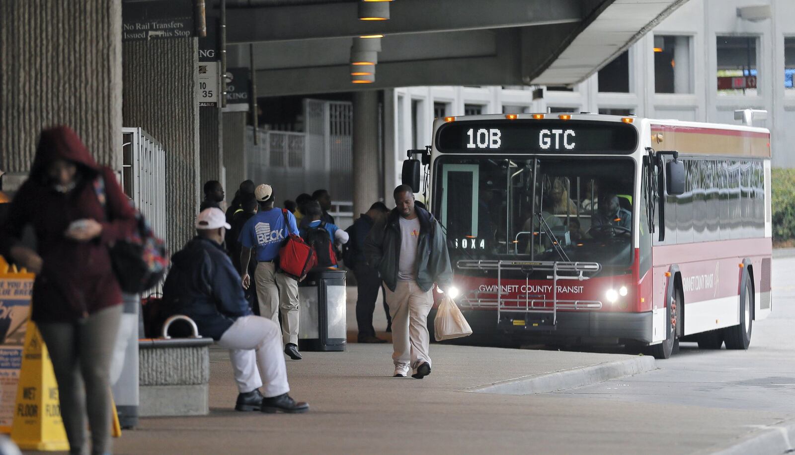 April 19, 2017 - Atlanta - MARTA passengers board a Gwinnett County Transit bus at the Doraville station. MARTAs Twitter account reported the parking lots were full at 8:11 AM. The collapse of a portion of I-85 some three weeks ago has been a headache for Atlanta drivers, but is proving to be a golden opportunity for MARTA. Long neglected in a car-crazy region, MARTA is getting a second look from commuters desperate to avoid gridlock. Ridership is up. MARTA parking lots are packed. BOB ANDRES /BANDRES@AJC.COM