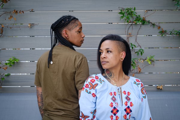 Taylia Trammell (right) poses for a portrait with her wife in Atlanta on Monday, June 13, 2022. (Arvin Temkar / arvin.temkar@ajc.com)