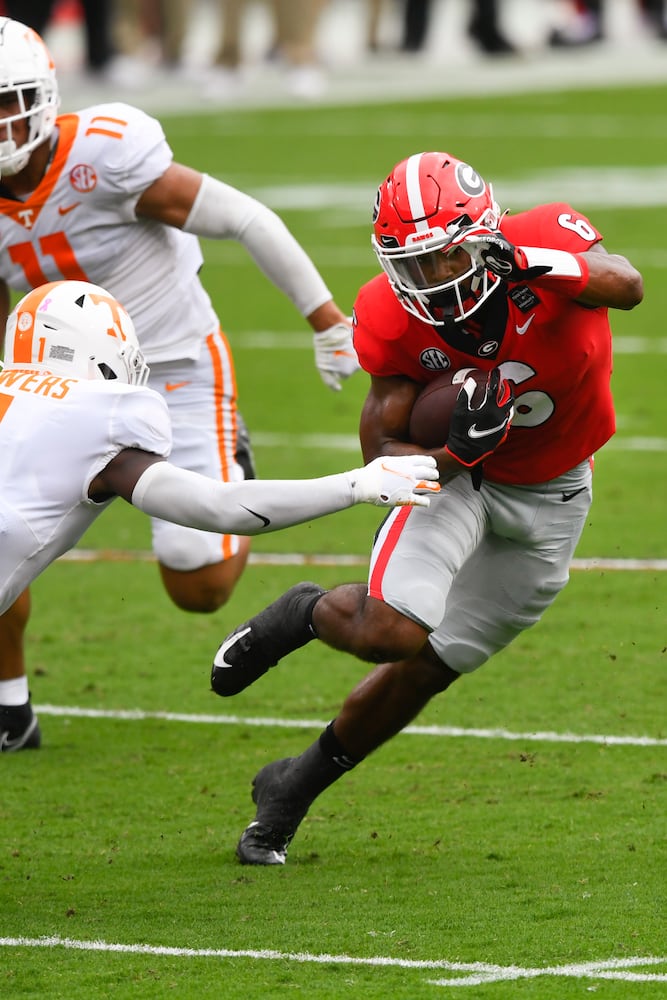 Georgia running back Kenny McIntosh (6) rushes against Tennessee during the first half of a football game Saturday, Oct. 10, 2020, at Sanford Stadium in Athens. JOHN AMIS FOR THE ATLANTA JOURNAL- CONSTITUTION