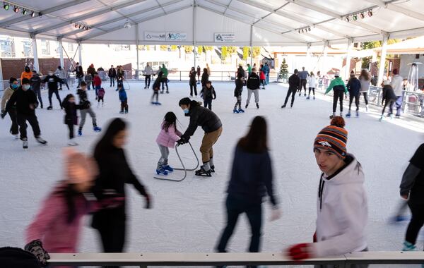 Skaters take to the ice at the Have an Ice Day rink in downtown Sugar Hill on Saturday afternoon, December 26, 2020. (Photo: Ben Gray for The Atlanta Journal-Constitution)