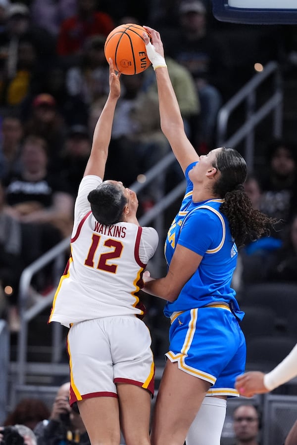 UCLA center Lauren Betts (51) blocks a Southern California guard JuJu Watkins (12) shot during the second half of an NCAA college basketball game in the championship of the Big Ten Conference tournament in Indianapolis, Sunday, March 9, 2025. (AP Photo/Michael Conroy)