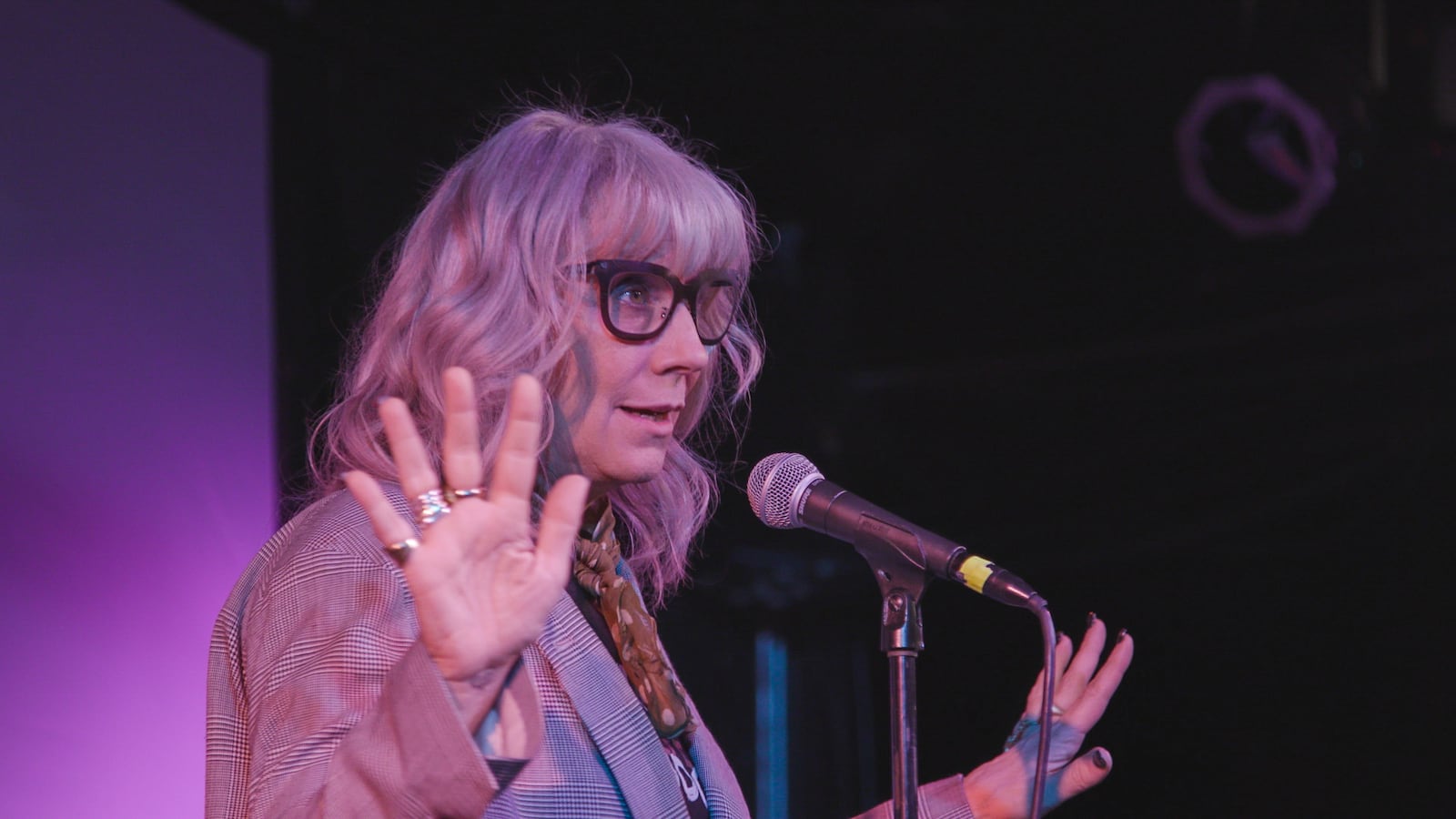 Comedian and activist Lizz Winstead performs on stage. Observing "the levity and joy that the comics and the team brought was a medicine for the melancholy,” says filmmaker Ruth Leitman. (Courtesy of Ruthless Films)