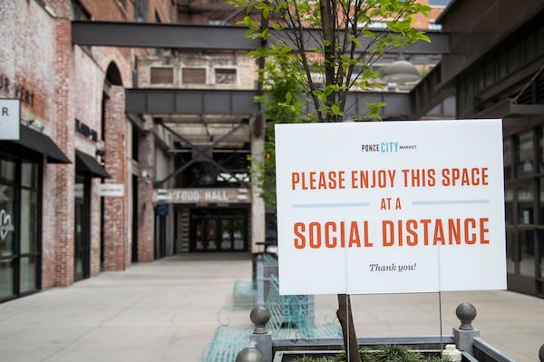 A sign encouraging social distancing is displayed at Ponce City Market in Atlanta’s Old Fourth Ward community on Monday, May 4, 2020. (ALYSSA POINTER / ALYSSA.POINTER@AJC.COM)