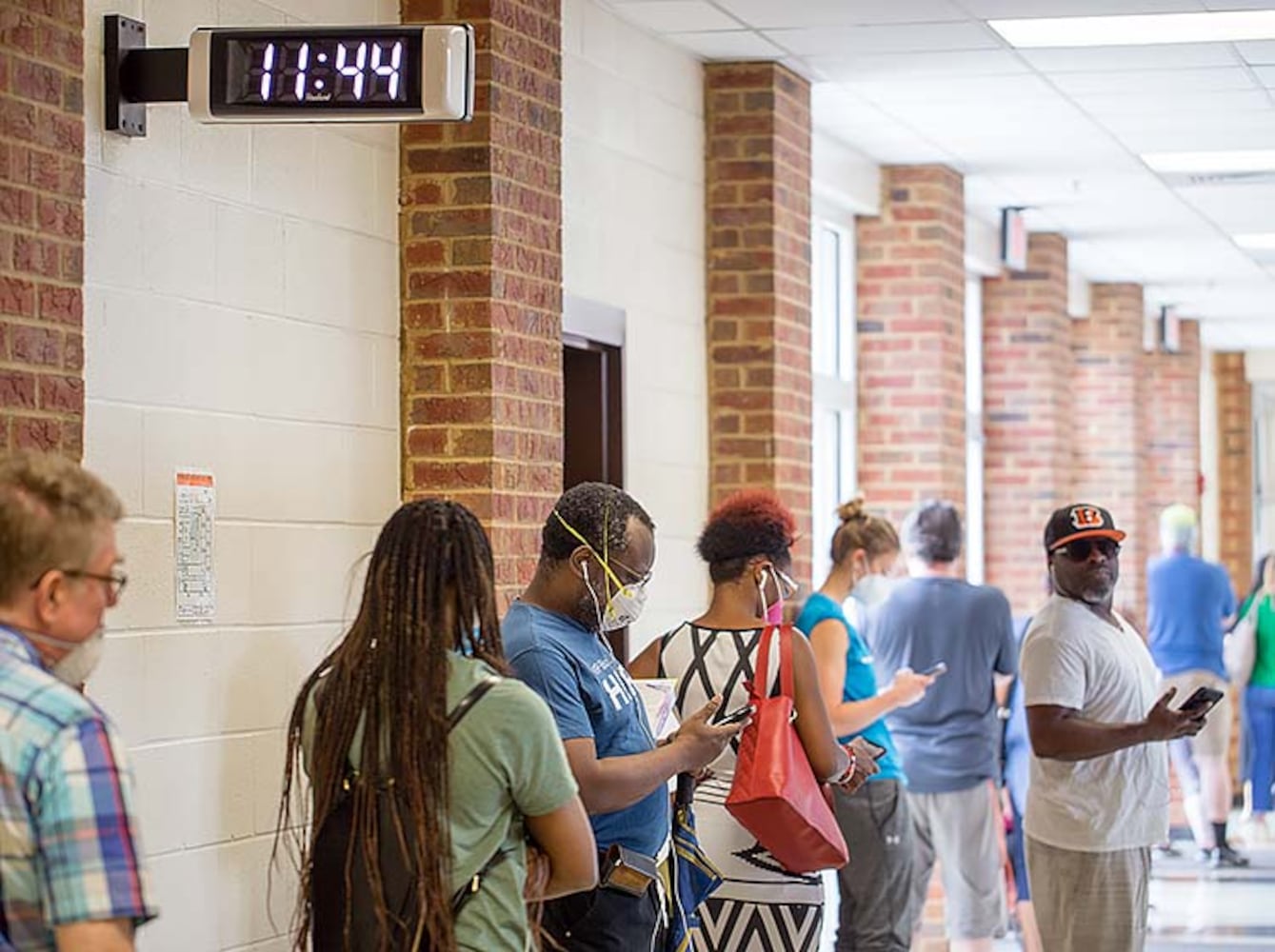 PHOTOS: Georgia voters struggle with long lines, new equipment, social distancing