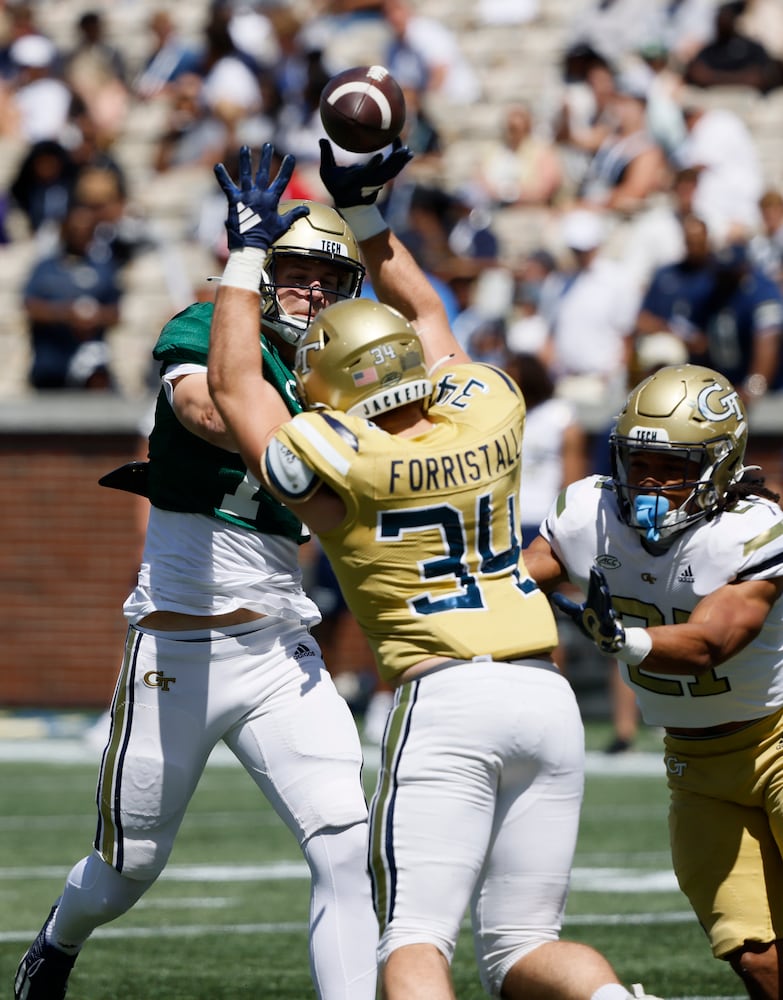 Georgia Tech quarterback Graham Knowles (14) has a pass tipped by Georgia Tech linebacker Myles Forristall (34) during the Spring White and Gold game at Bobby Dodd Stadium at Hyundai Field In Atlanta on Saturday, April 13, 2024.   (Bob Andres for the Atlanta Journal Constitution)