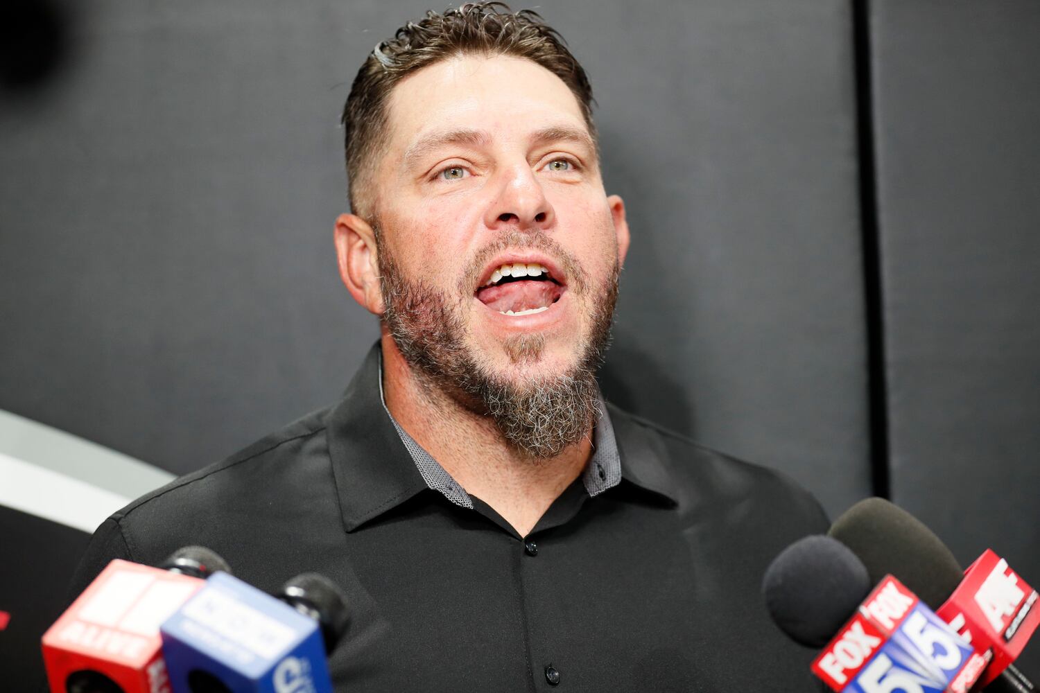 Former Falcons center Todd McClure speaks with the media on Sunday before the Falcons-Panthers game at Mercedes-Benz Stadium. McClure was inducted into the club’s Ring of Honor at halftime. (Miguel Martinez / miguel.martinezjimenez@ajc.com)