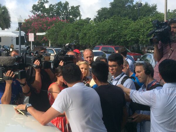  Reporters interview a young woman whose brother was among the Pulse nightclub shooting victims. Photo: Jennifer Brett, jbrett@ajc.com