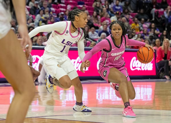 LSU guard Mjracle Sheppard (1) defends against Georgia guard De'Mauri Flournoy (10) during an NCAA college basketball game Thursday, Feb. 20, 2025, in Baton Rouge, La. (Hilary Scheinuk/The Advocate via AP)