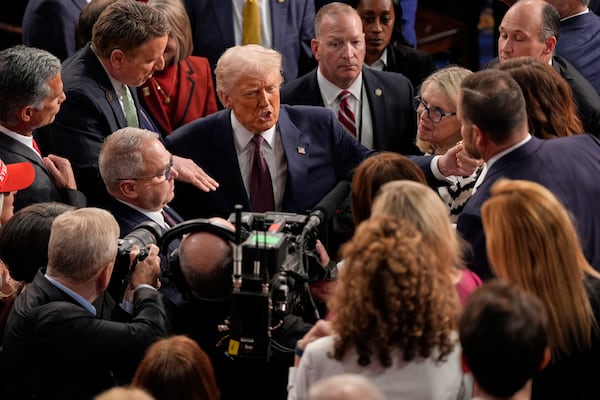 President Donald Trump greets people after addressing a joint session of Congress in Washington on Tuesday.